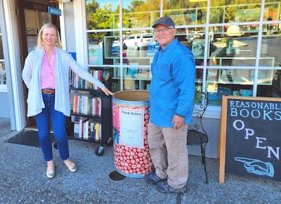 Members of the Moraga Valley Presbyterian Church with a Bay Area Rescue Mission food barrel at Reasonable Books.
